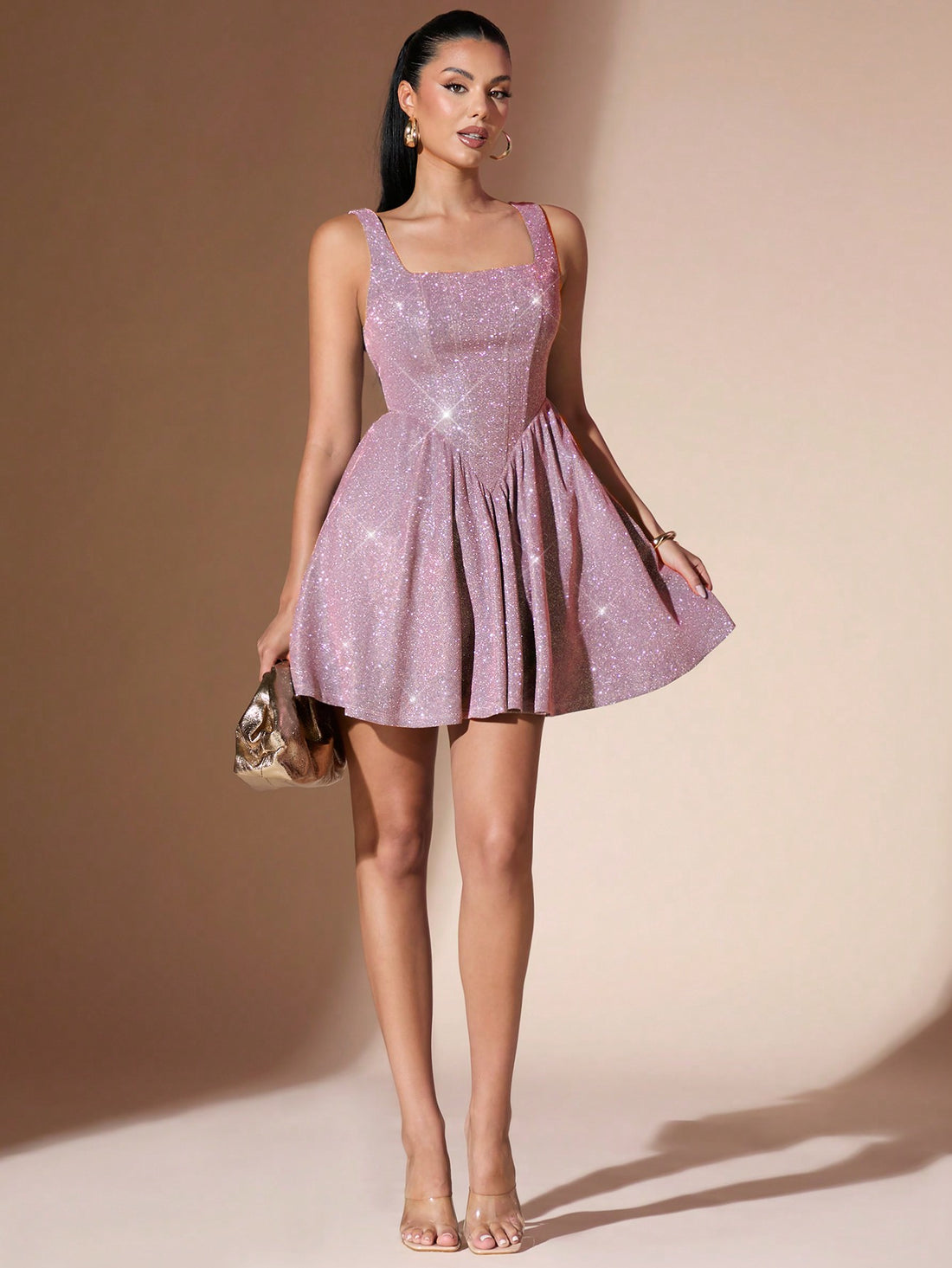 Experience elegance and sparkle all year round with our Sleeveless Pleated Sequin Dress. Perfect for any season, this dress will elevate your style and make you stand out in any crowd. Get ready to shine and make a statement in this stunning piece.