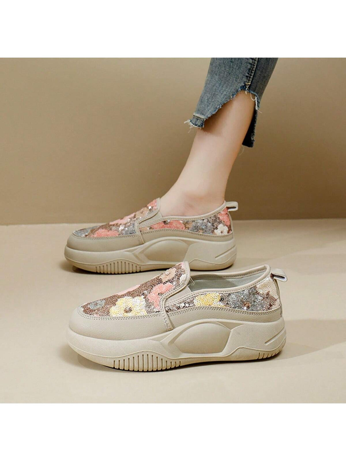 Benefit from effortless style with our Sparkling Floral Slip-On Sneakers. These slip-on sneakers feature a sparkling floral design that adds a touch of glamour to any outfit. The slip-on style allows for easy on-and-off, making them perfect for busy days and on-the-go activities. Elevate your style with these chic and comfortable sneakers.