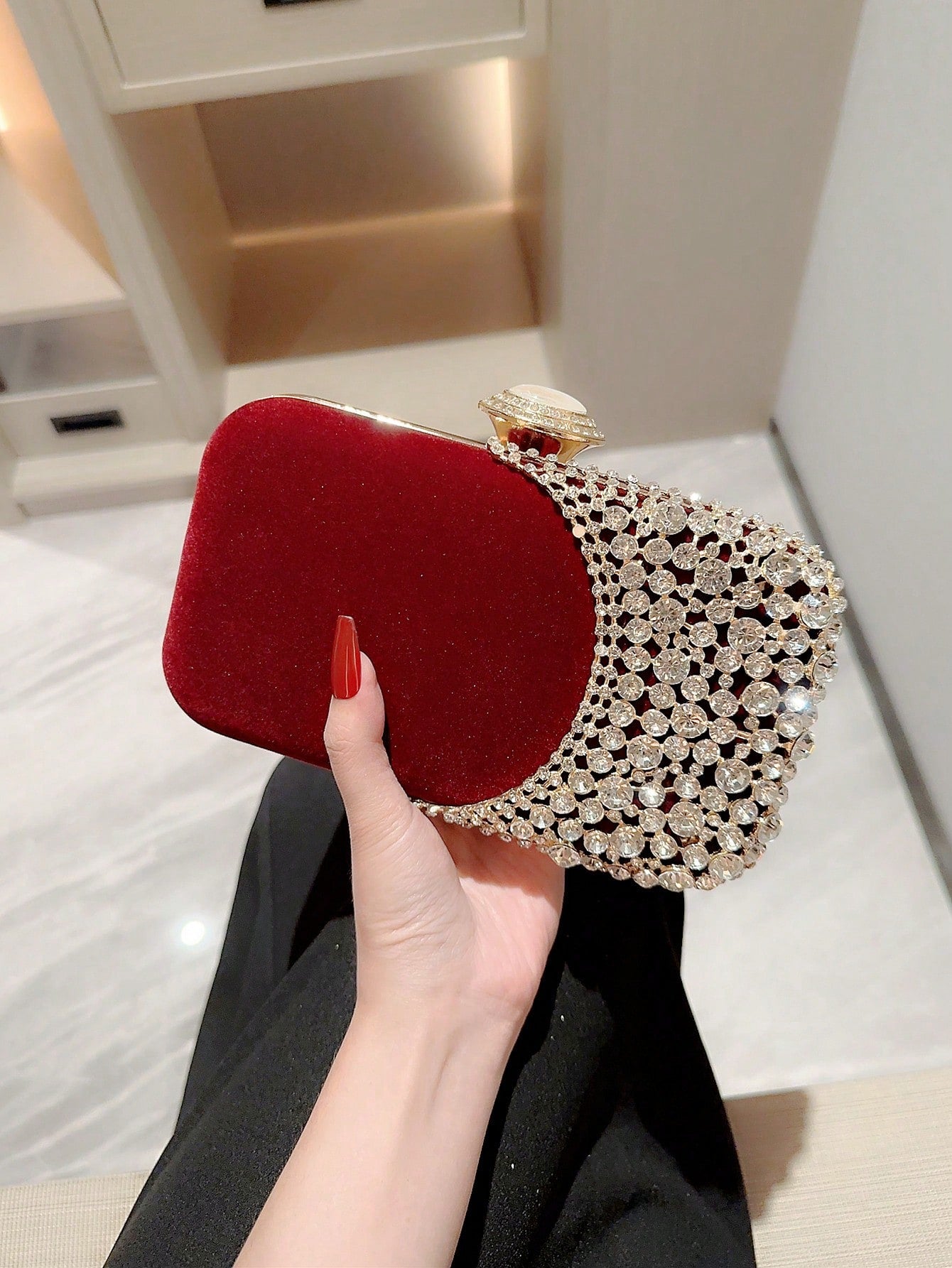 Elevate your formal attire with the Sparkling Moonlit Eve Clutch. This elegant evening bag features rhinestone embellishments, adding a touch of sparkle to your ensemble. Perfect for special occasions, this clutch exudes sophistication and style. Complete your look with this exquisite accessory.