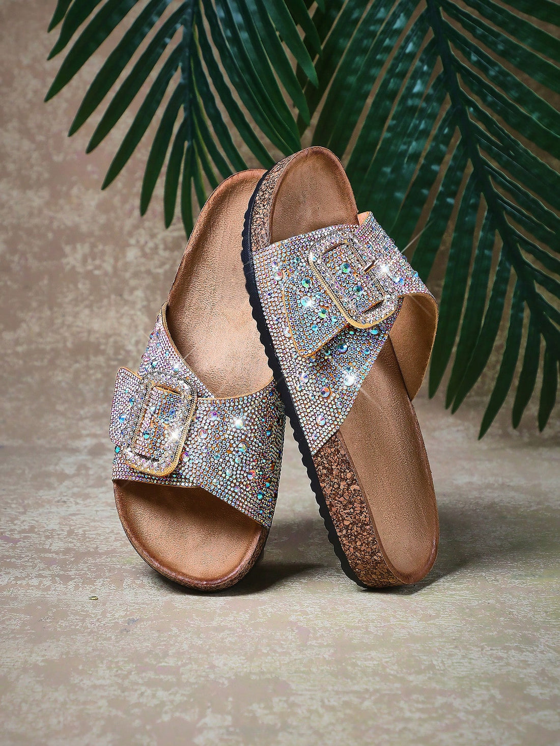 Step out in style with these Sparkling Rhinestone Buckle Open Toe Cork Sandals! Featuring a dazzling buckle and comfy cork sole, they add a touch of luxe champagne sparkle to every step. Perfect for sunny days when you want to shine and stay effortlessly comfortable.