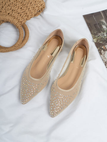 Step up your style game with these dazzling ballet flats. The pointed toe and sparkling rhinestones add a touch of chic to any outfit. Perfect for any occasion, from work to a night out. Shine bright and step confidently with these flats.