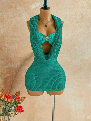 Teal open-weave hooded mini dress on mannequin with matching sequin shell bra and silver sunburst center hardware