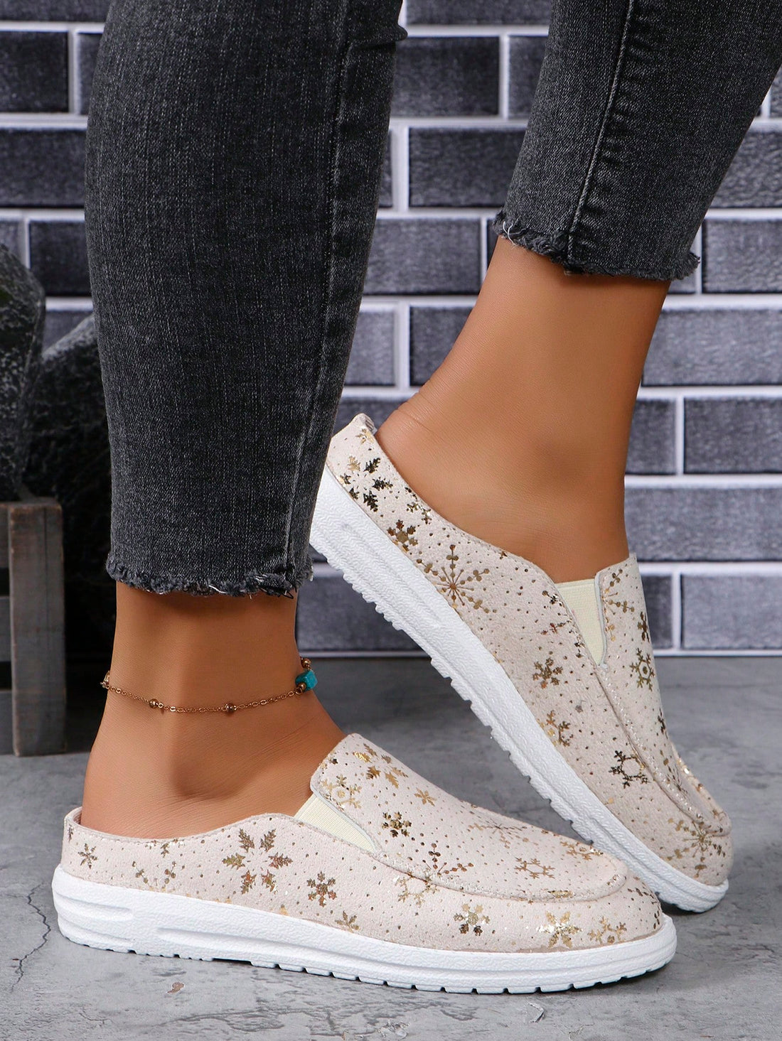 Introducing our Sparkling Snowflake Slip-Ons - the perfect blend of style and comfort. With a sporty design and sparkling snowflake embellishments, these casual shoes are sure to make a statement. Slip them on for a touch of glam to any outfit.