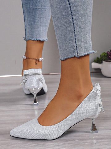 Elevate your bridal ensemble with our Sparkling Stiletto Heels. Designed specifically for weddings, these pointed toe shoes offer a sleek silver finish that sparkles under the lights. With a stiletto heel, these shoes provide both style and stability, making them the perfect choice for any bride.