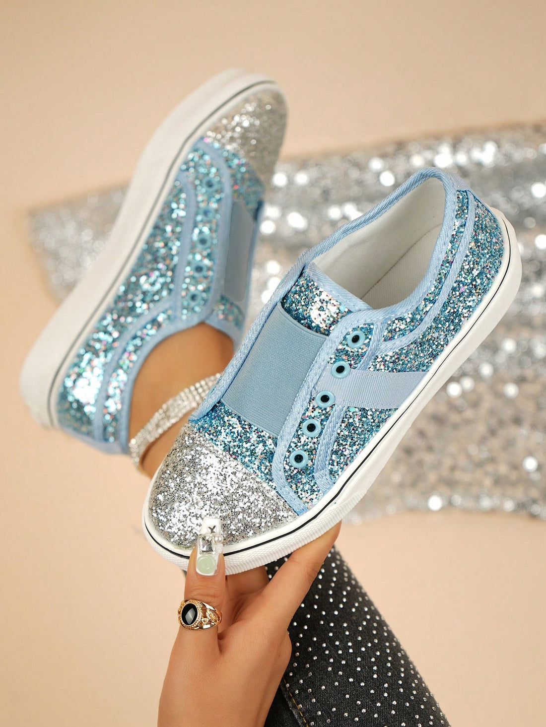 Step into sparkle with these eye-catching colorblock sequin canvas slip-on sneakers! Perfect for adding a playful pop to any outfit, these dazzling kicks combine comfort and glamour effortlessly. Slide them on and transform even your most casual looks into statement-making ensembles. Who said comfort can't be fabulous?
