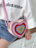 Introduce your child to style with our Sparkly Heart Shaped Mini Crossbody Bag. Crafted from synthetic leather, this trendy bag features a colorful color block design that is sure to make a statement. Perfectly sized for kids, your little one can carry their essentials with ease while adding a touch of sparkle to their outfit.