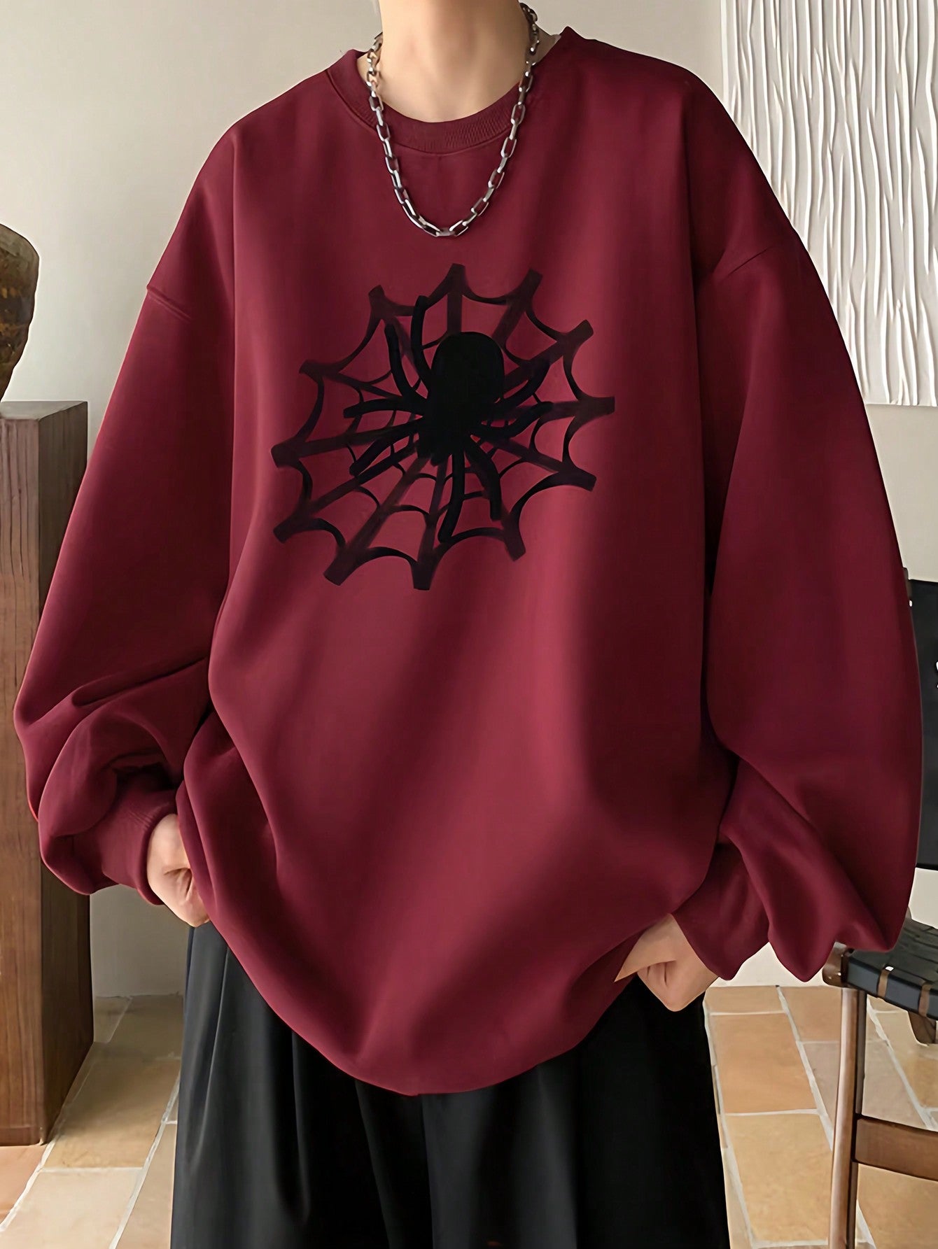 Introducing our Spider Web Chic men's pullover with a unique drop shoulder design. Made with high-quality fabrics for maximum comfort and style. Perfect for any occasion with its sleek and modern look. Upgrade your wardrobe with this must-have piece.