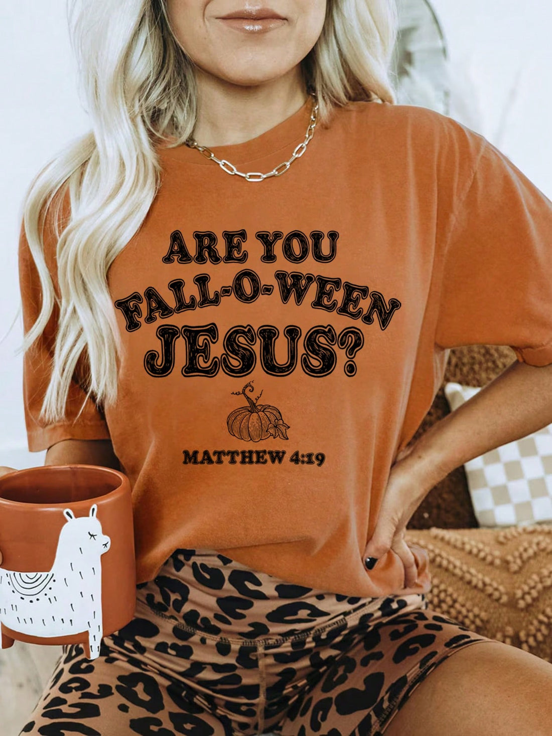 Elevate your Halloween wardrobe with our Spooktacular Style: Black Pumpkin Graphic Tee for Women. Crafted with soft, high-quality fabric, this tee features a bold black pumpkin graphic that adds a touch of spooky fun. Perfect for any Halloween gathering or casual outing, it's a must-have for any fashion-forward woman.