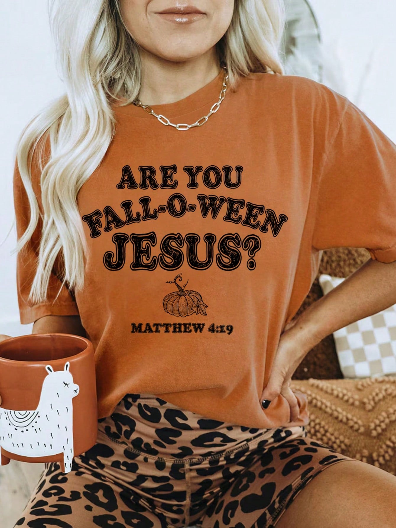 Elevate your Halloween wardrobe with our Spooktacular Style: Black Pumpkin Graphic Tee for Women. Crafted with soft, high-quality fabric, this tee features a bold black pumpkin graphic that adds a touch of spooky fun. Perfect for any Halloween gathering or casual outing, it's a must-have for any fashion-forward woman.