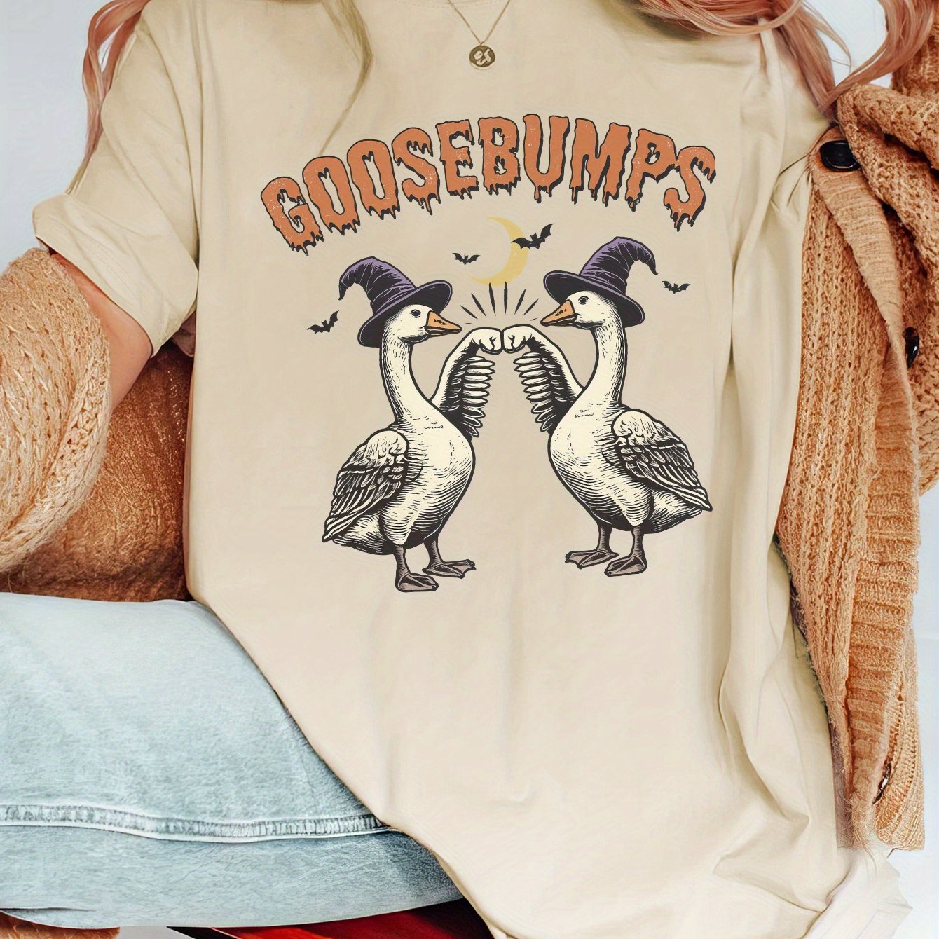 Upgrade your Halloween wardrobe with Spooky Chic! This oversized casual tee boasts ultimate comfort and style, making it the perfect addition to your festive ensemble. With its eye-catching design and comfortable fit, you'll be sure to turn heads while staying cozy all season long.