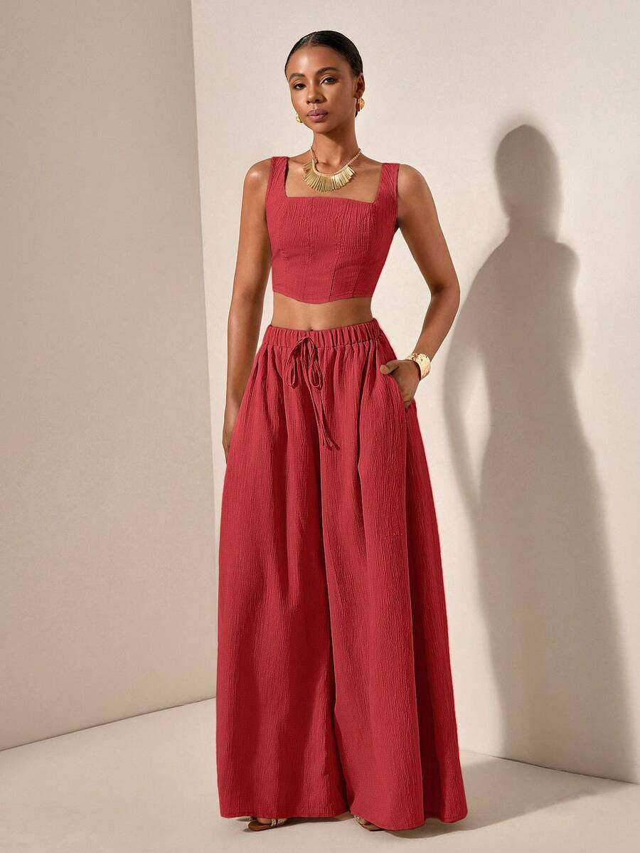 Elevate your warm-weather wardrobe with this effortless Spring/Summer set. The fishbone-patterned camisole features a flattering square neckline and convenient pockets, paired with wide-leg pants that move beautifully. Crafted from a breathable polyester-elastane blend in rose red, this versatile duo transitions seamlessly from vacation getaways to casual home days. Machine washable for easy care, it's the relaxed, stylish essential you'll reach for again and again.
