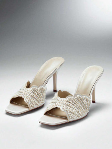 Make a sophisticated statement with these glamorous square toe stiletto sandals for women. Designed with a sleek slip on silhouette, elegant square toe, and slender stiletto heel, these sandals create a refined and feminine look that instantly elevates dressy outfits.