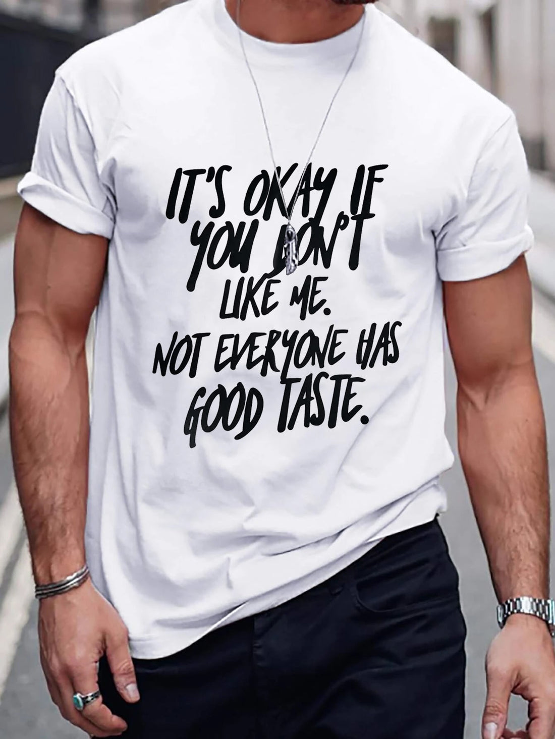 Make a statement in this stylish Men's Slogan Graphic Tee. With a bold slogan design, this shirt is sure to turn heads. Stand out from the crowd and show off your unique sense of style. Comfortable and fashionable, this tee is a must-have for any fashion-forward man.