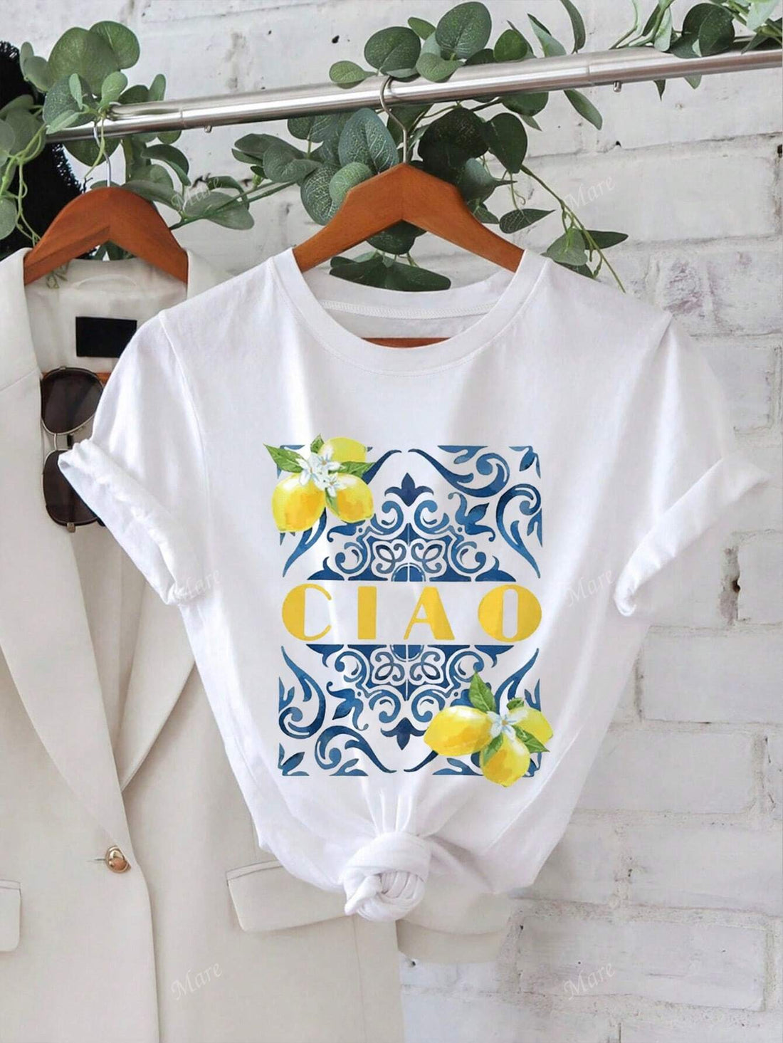 Looking for a refreshing summer look? The CIAO Lemon Print Casual T-Shirt has got you covered. With bold lemon prints and effortless style, stay fresh and on trend all season long. Get ready to turn heads with this quirky and fun t-shirt.