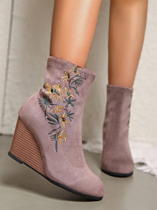 Step out in style with our Embroidered Floral High-Heel Chunky Ankle Boots. These chic and fashionable boots feature elegant embroidered floral designs and a sturdy high-heel for a confident and stylish stride. Elevate any outfit with these must-have boots.