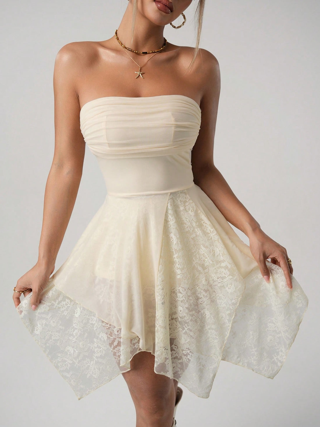 Make a statement in this flirty strapless mini dress! The asymmetric hem adds a dash of drama while the square neckline frames your décolletage perfectly. Playful ruffles and pleated details create movement with every step. Perfect for turning heads at summer parties or date nights when you're feeling extra sassy!
