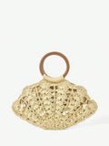 Beige straw shell shaped beach bag with brown round handle pearl and shell charms