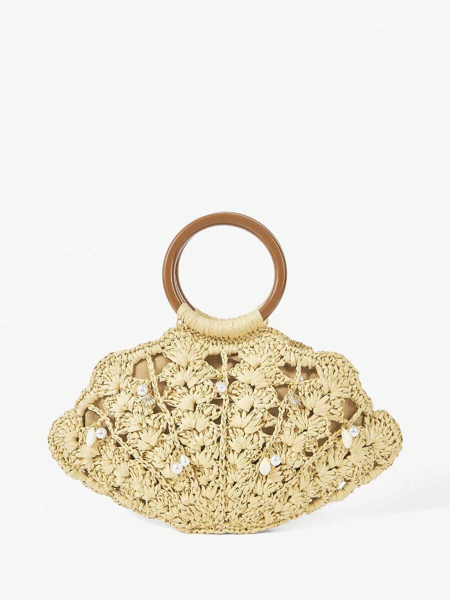 Beige straw shell shaped beach bag with brown round handle pearl and shell charms