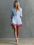Front studio view of blue striped button-front mini shirt dress with red flared hem