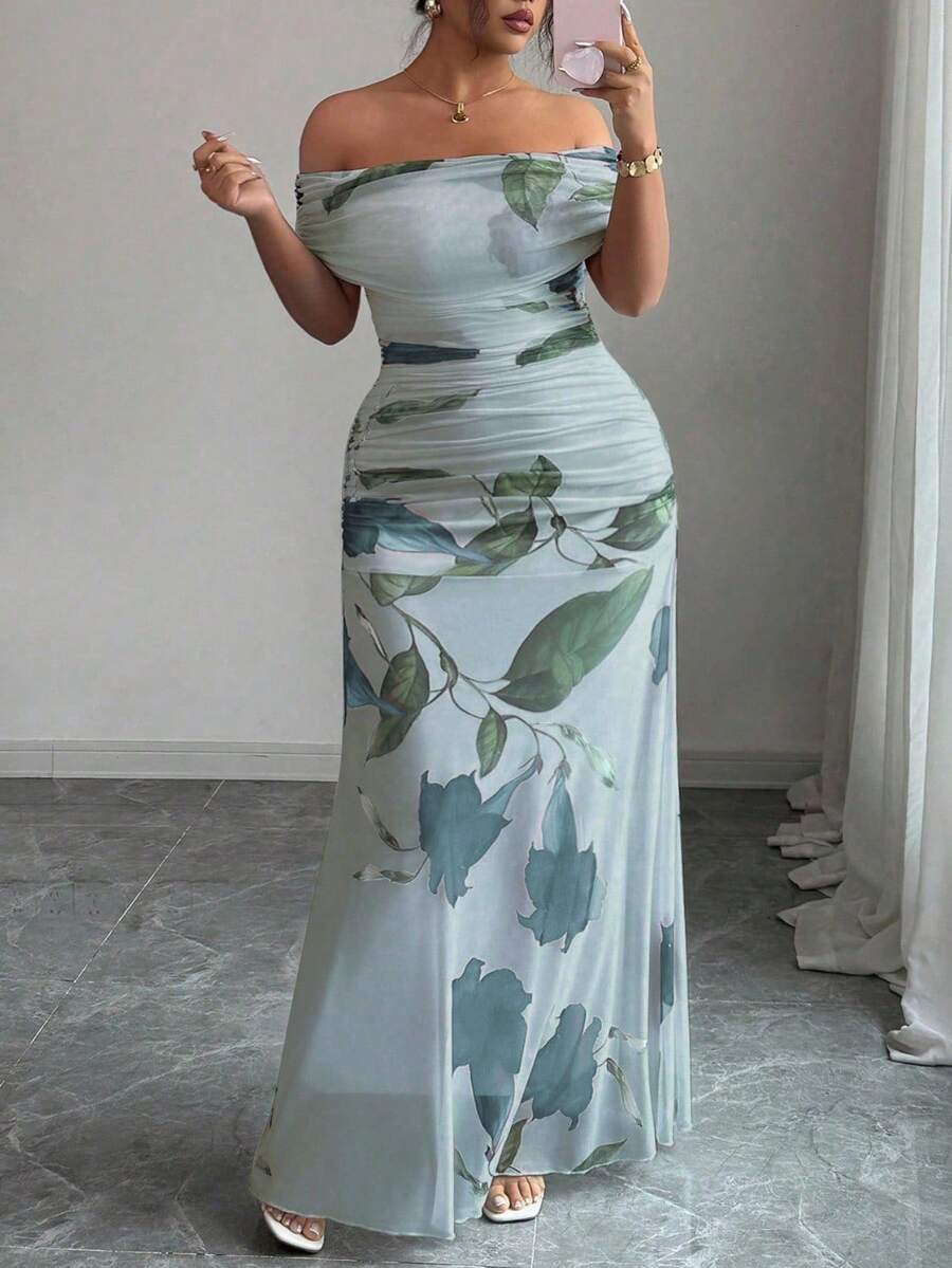 Make a statement in this show-stopping plus-size evening dress that celebrates your curves with style. The off-shoulder neckline creates an effortlessly chic silhouette, while strategic ruching flatters your figure beautifully. Delicate mesh print detailing adds visual interest and sophistication to every angle. Perfect for galas, weddings, or any occasion where you want to feel absolutely fabulous. Slip into confidence and let your elegance do the talking.
