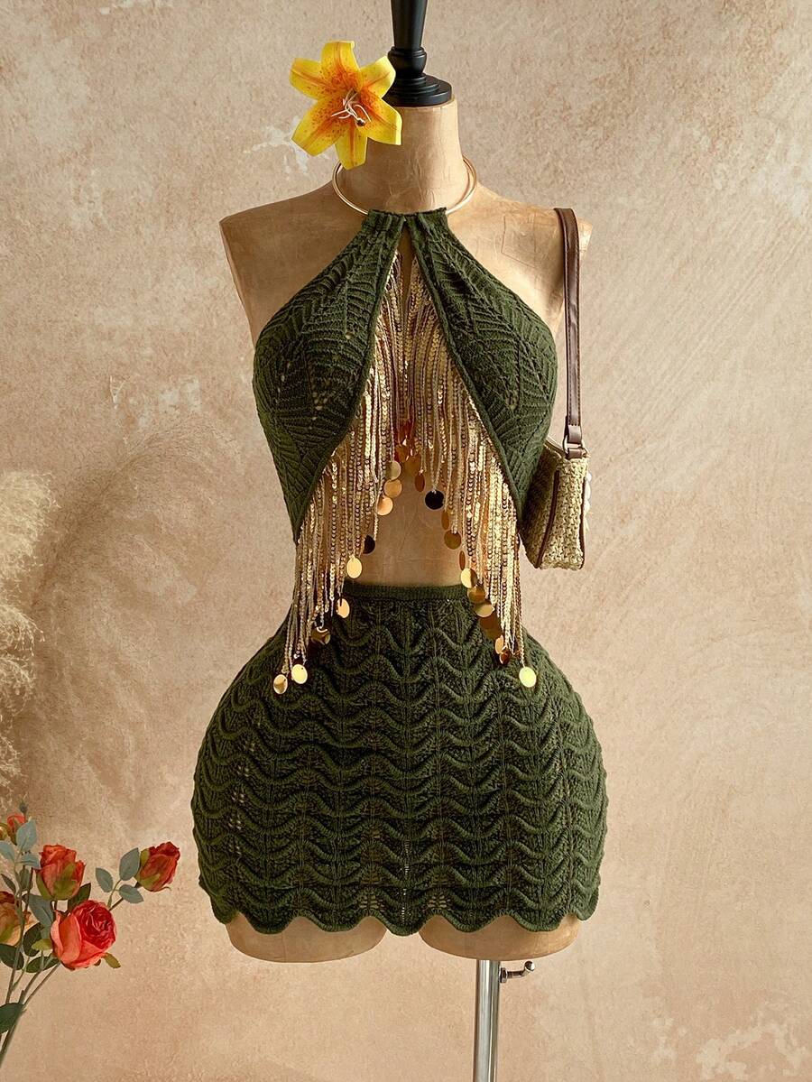 Elevate your summer wardrobe with this eye-catching sequin tassel halter knit dress. The shimmering sequin detailing and playful tassel accents create instant glamour, while the flattering halter neckline offers elegant support. 