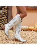 Step up your cowgirl style with these Stunning Silver Metallic Cowboy Boots! These boots feature butterfly embellishments that add a touch of femininity to the authentic cowgirl design. Made with high-quality materials, these boots are durable and stylish. Perfect for any cowgirl looking to make a statement.