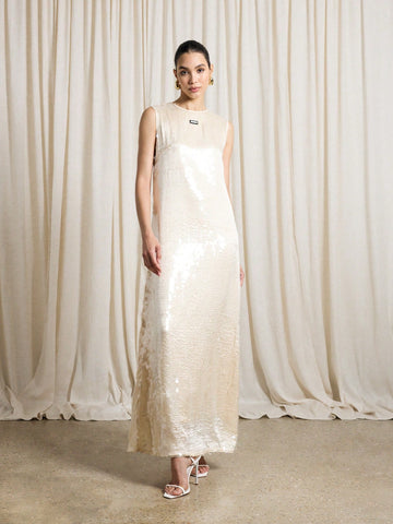 Turn heads and sparkle all night in this sleeveless sequin maxi dress. Its floor-length design flows with every step, making it an effortless choice for weddings, parties, or any special occasion where you want to shine. Lightweight and dazzling, this gown combines comfort with eye-catching glamour, ensuring you're the star of the show wherever you go.