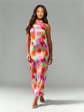 Step into summer celebrations with this playful tie-dye pearl back halter neck maxi dress. Its breezy silhouette flatters your figure while the unique pearl-detailed back adds an unexpected touch of elegance. Perfect for weddings or any formal occasion, this dress lets you dance the night away in style and comfort. Make every moment memorable with a splash of color and sparkle!
