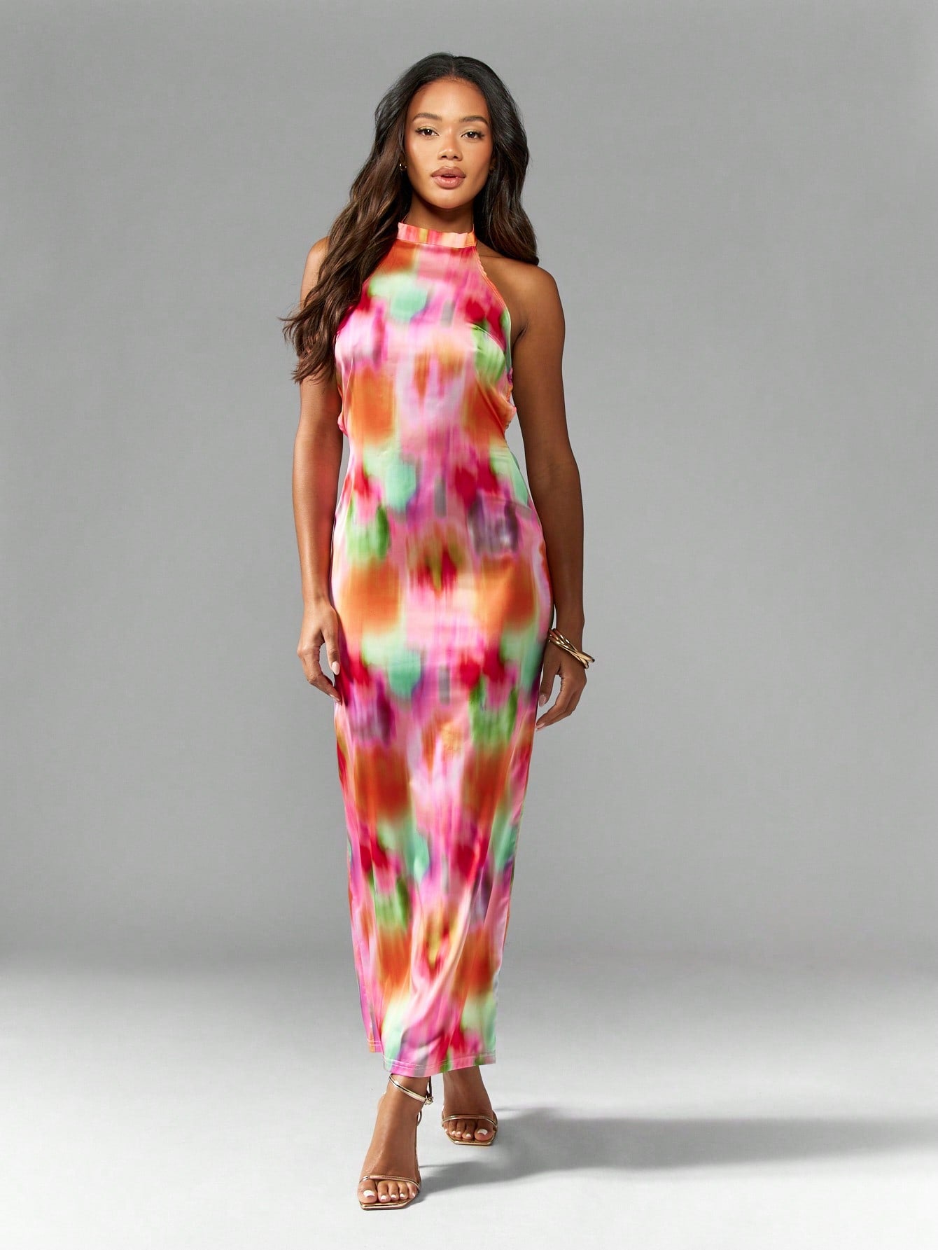 Step into summer celebrations with this playful tie-dye pearl back halter neck maxi dress. Its breezy silhouette flatters your figure while the unique pearl-detailed back adds an unexpected touch of elegance. Perfect for weddings or any formal occasion, this dress lets you dance the night away in style and comfort. Make every moment memorable with a splash of color and sparkle!