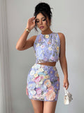 Turn heads in this stunning two-piece set featuring intricate 3D embroidered mesh detailing that catches the light beautifully. The fitted crop top pairs perfectly with a flowy mini skirt, creating an effortlessly chic silhouette that works for date nights, weekend parties, or tropical getaways. The delicate mesh fabric adds an alluring touch while the embroidered accents elevate your look from basic to breathtaking. Whether you're dancing the night away or soaking up vacation vibes, this set delivers major