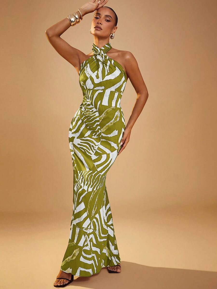 Turn heads effortlessly in this Stylish Animal Print Cross Halter Maxi Dress. Its playful cross halter design pairs perfectly with the bold animal print, making it your go-to for a chic, carefree vibe. Flowing maxi length ensures comfort and movement, keeping you stylish from day to night with zero fuss.