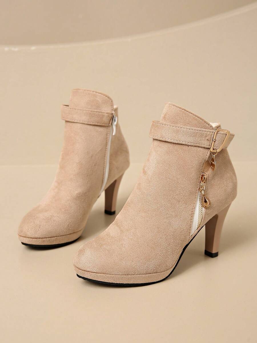 Step out in style this season with these chic Autumn-Winter high heel ankle boots for women. Featuring a sleek side zipper for easy on and off, they blend comfort with a confident edge. Perfect for cozy days and festive nights, these boots add a playful twist to any outfit while keeping you warm and stylish.