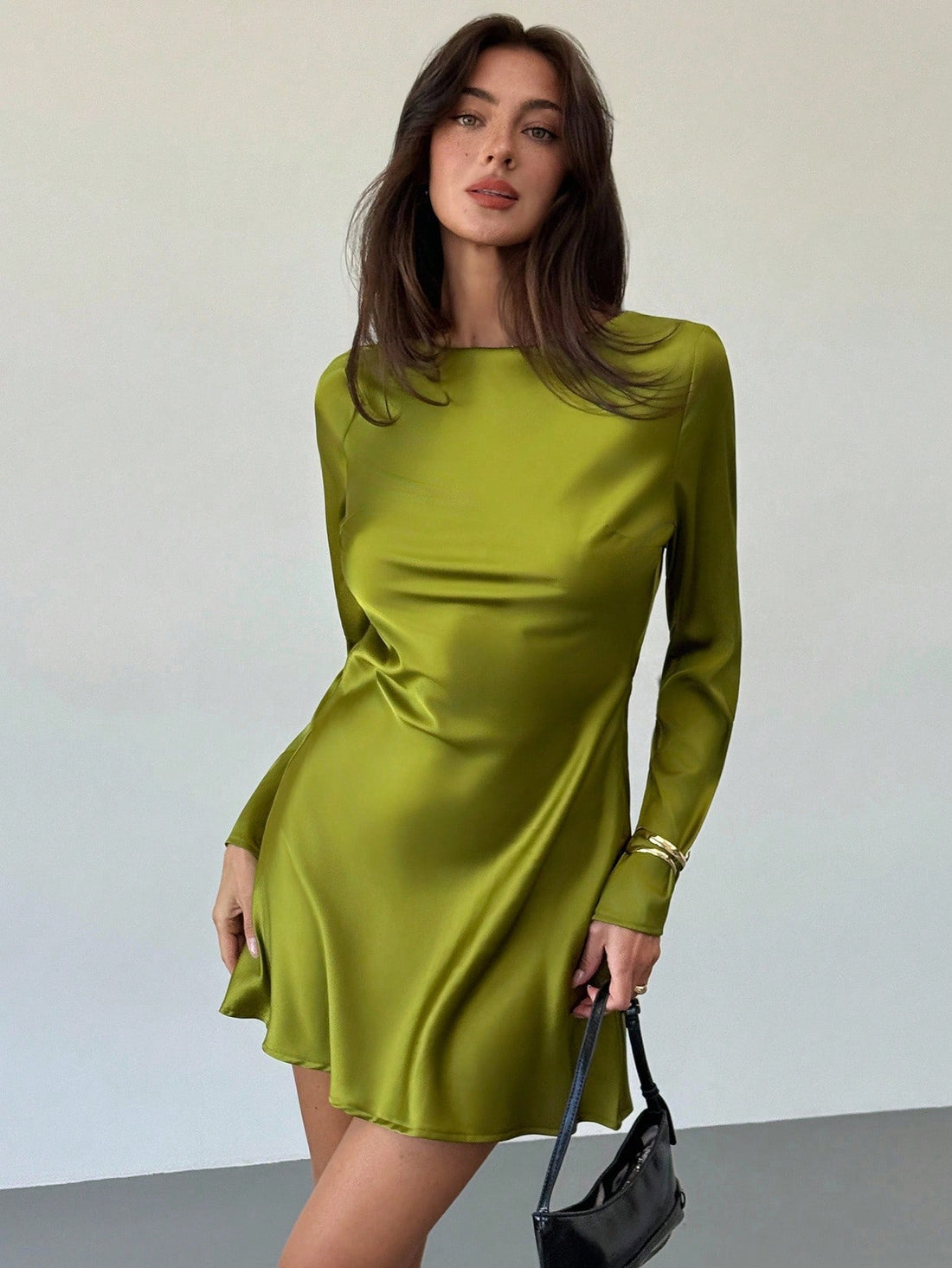 Turn heads in this playful avocado green backless mini dress, designed to spark joy on romantic dates or as a charming choice for wedding guests. Its flirty cut and vibrant color highlight your confidence while keeping things light and fun. Perfect for dancing the night away or stealing the spotlight with effortless style.