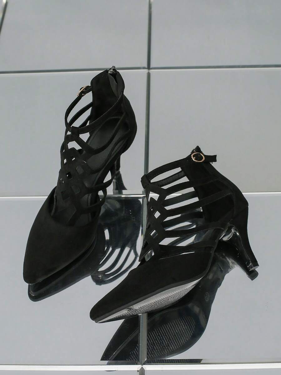 These striking black stiletto heels feature an elegant hollow-out design that adds contemporary flair to your evening wardrobe. The sleek silhouette and refined stiletto heel deliver the sophisticated lift you need for fall and winter celebrations, from cocktail parties to formal gatherings. Crafted for those who appreciate timeless elegance with a modern edge, these heels transition seamlessly from dinner events to night-out occasions. The bold cutout detailing showcases your personal style while maintaini