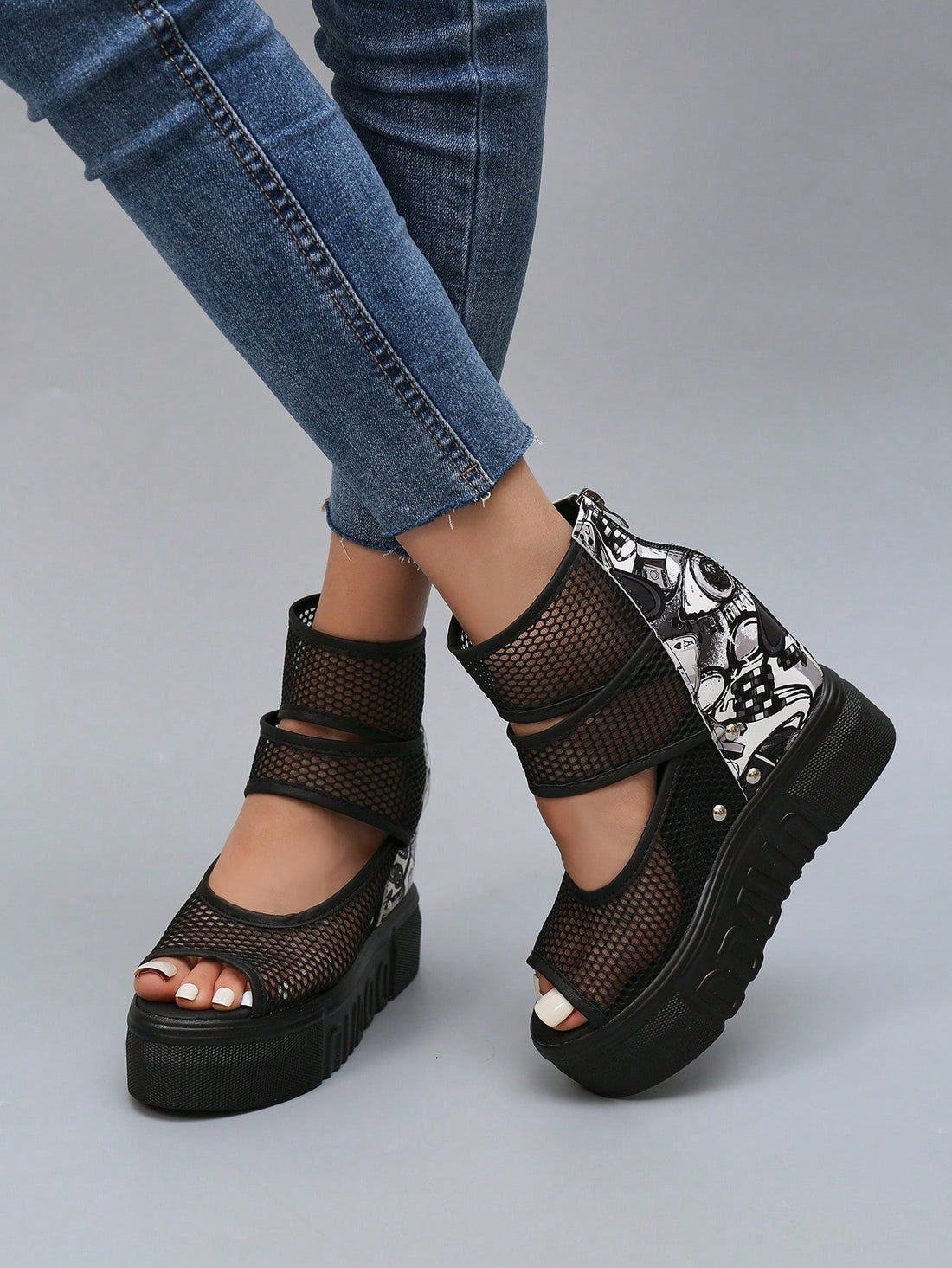 Elevate your style with our stylish black mesh platform wedge sandals. Designed with a waterproof bottom, they provide both fashion and function. Embrace the trend while staying dry and comfortable in any weather. These sandals are perfect for the modern and fashion-forward woman.