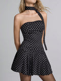 Step into summer with this playful black dress adorned with charming polka dots and ditsy floral prints. Its lightweight fabric keeps you cool whether you're at the office or dancing at a festival. Flattering and fun, this dress effortlessly blends professional style with carefree vibes for any sunny occasion.