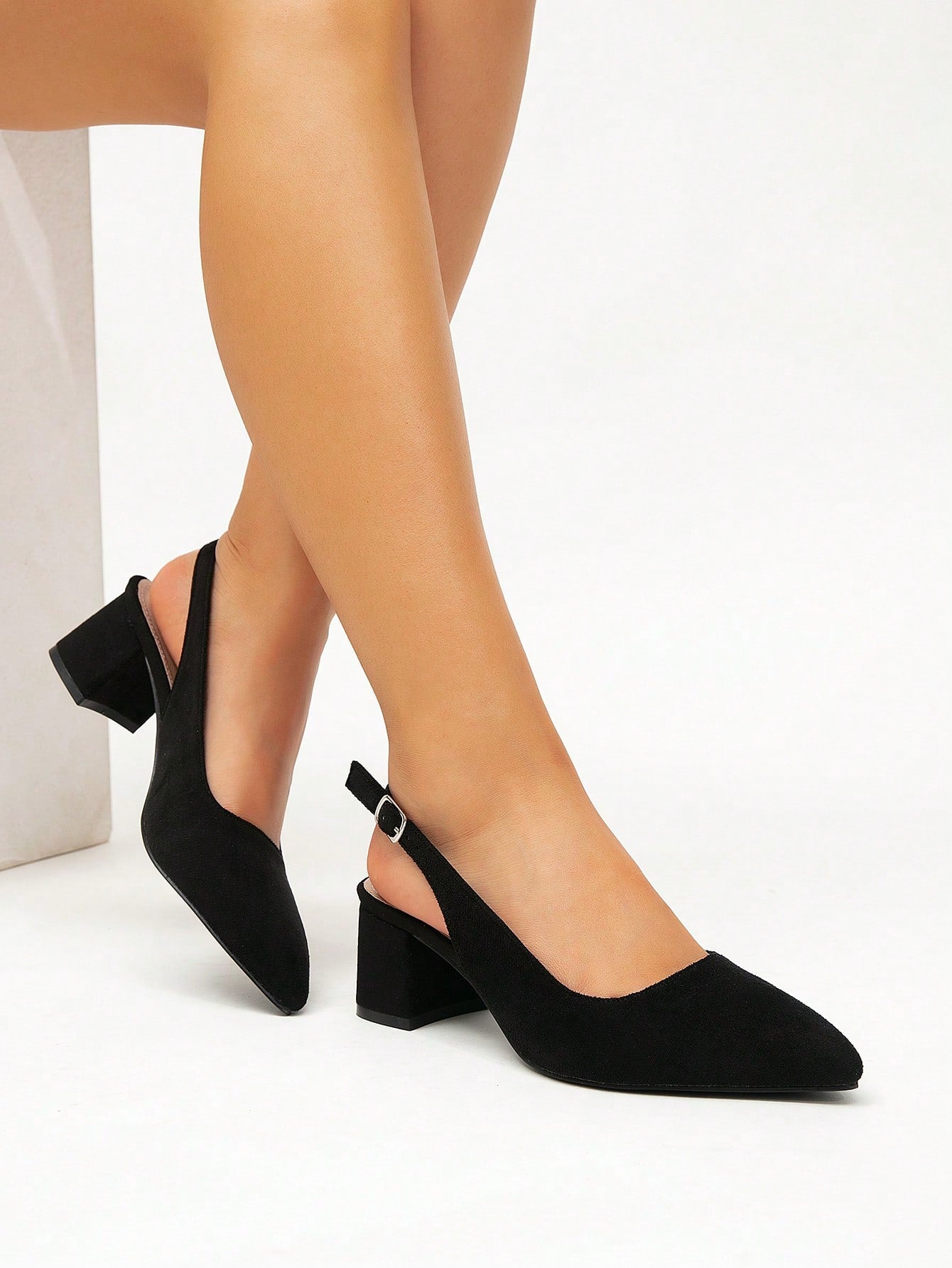 Step out in style and comfort with these black suede pointed toe shoes, designed for the busy woman on the go. The chunky heel adds a trendy twist while keeping your feet happy during those long office hours or your daily commute. Perfectly blending chic and practical, these shoes will have you striding confidently from desk to dinner with a playful flair.