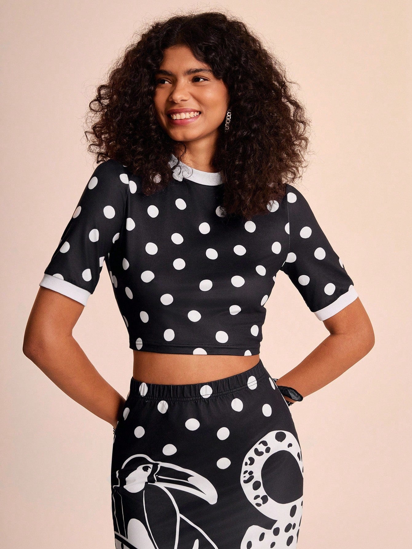 Spread your wings with this eye-catching parrot print two-piece set! Featuring bold black and white graphics that make a statement, this versatile ensemble is your go-to for laid-back getaways and casual adventures. The coordinated top and bottom combo takes the guesswork out of styling, letting you look effortlessly put-together whether you're exploring tropical destinations or enjoying weekend vibes at home. Comfortable, chic, and ready to turn heads—this set proves that vacation style doesn't have to be 