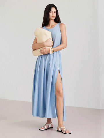 Step out in style with this playful blue sleeveless dress designed for effortless casual charm. Featuring a flattering round neck and a cheeky side slit, it offers both comfort and a hint of flirty flair. Perfect for sunny days or relaxed evenings, this dress keeps you cool while turning heads wherever you go.