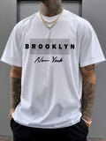 Unleash your inner New Yorker with our Brooklyn Print Tee! This laid-back short sleeve champion is ready to take your casual game from 