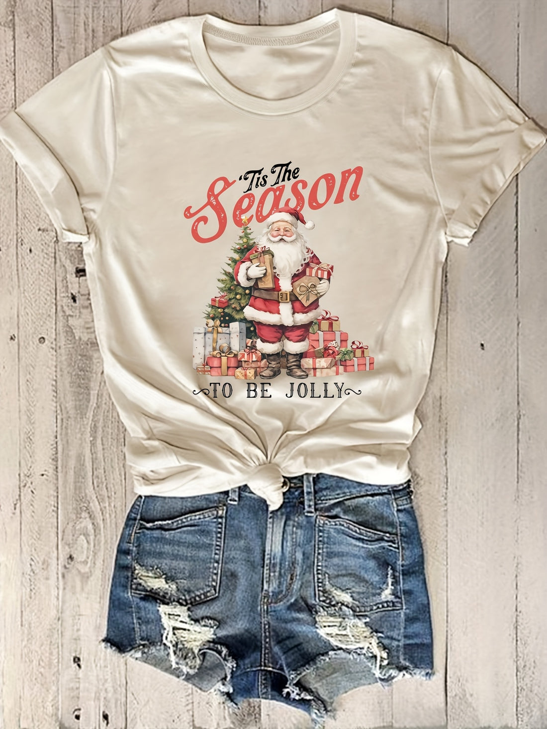 Experience the perfect mix of style and versatility with our Chic Women's Santa Print Tshirt. Its unique design adds a festive touch, making it a must-have fashion accessory for any occasion. Crafted with quality materials, this tshirt offers both comfort and durability, making it a wardrobe staple.