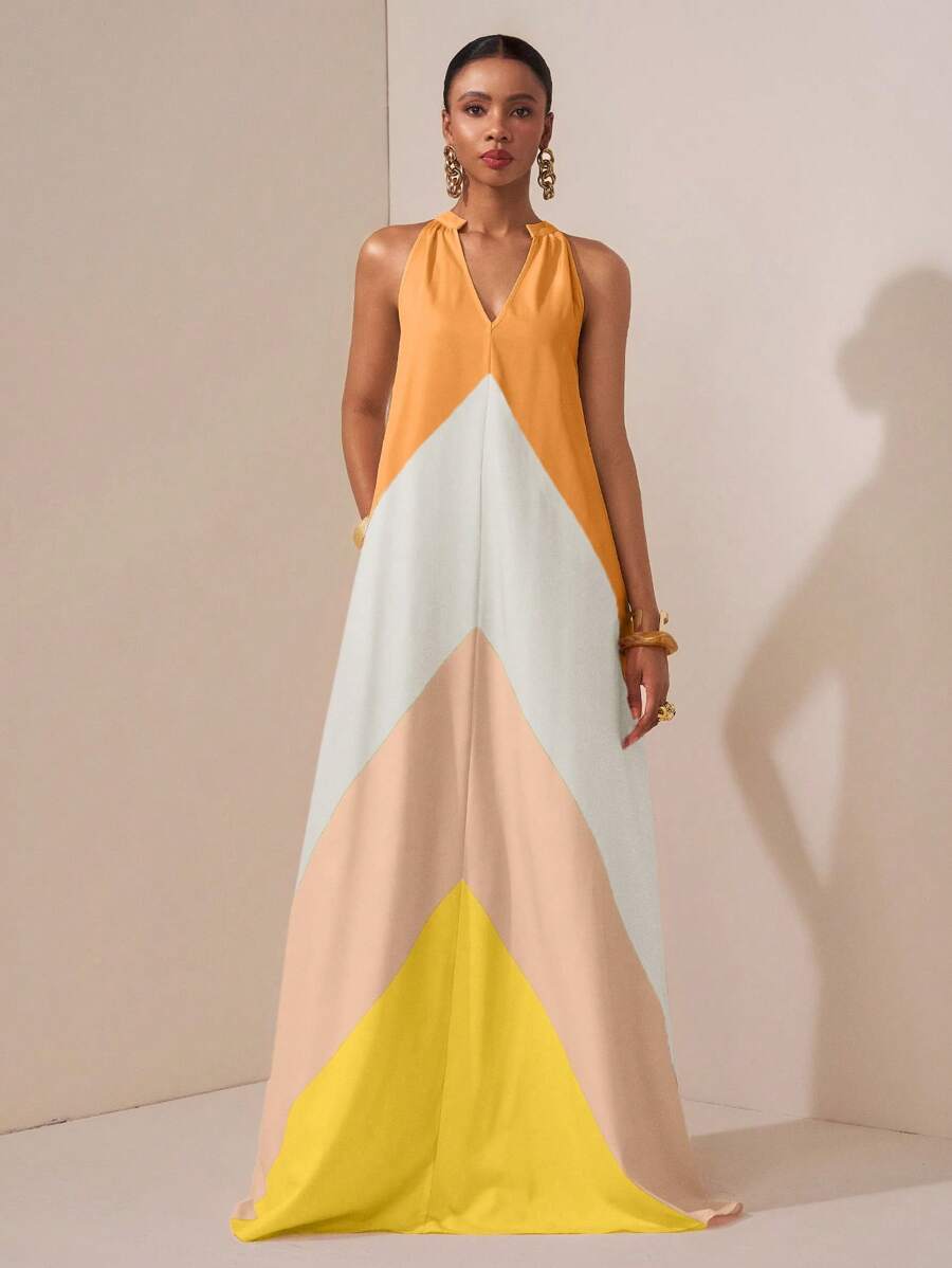 Turn heads this summer with our Stylish Color-Block Maxi Dress! Its vibrant blocks of color bring fun and flair to any occasion—whether you're dancing at a party, strolling along the beach, or just embracing everyday chic. Lightweight and flowy, it keeps you cool and comfortable while making a bold fashion statement. Perfect for those who love to mix style with ease and a splash of playful charm.