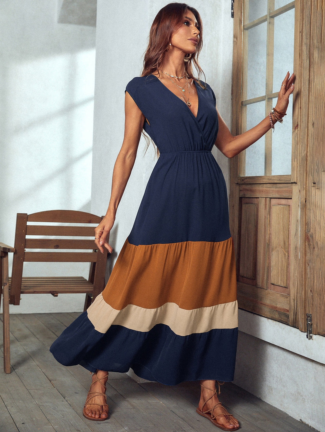 Make a statement with this Stylish Colorblock Maxi Dress! With its surplice neckline and flattering silhouette, it's perfect for any vacation or beach outing. Stand out in a bold colorblock design that's sure to turn heads. Comfortable and trendy, this dress is a must-have for any fashion-forward woman.