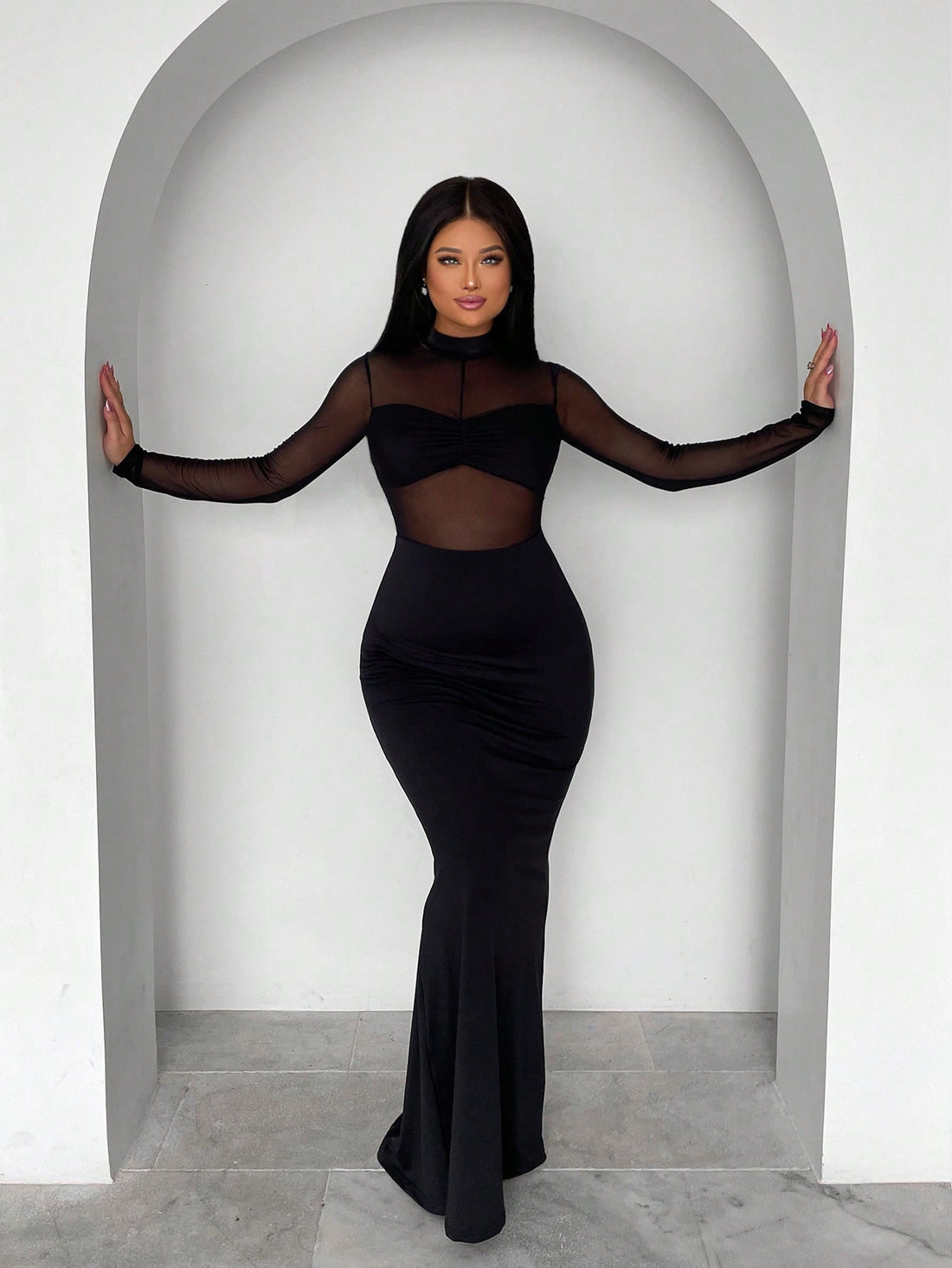 Turn heads this season in our stunning contrast mesh mermaid hem bodycon maxi dress. The figure-hugging silhouette flatters your curves while the sheer mesh panels add an edgy, modern twist. The dramatic mermaid hem creates movement and flair with every step. Whether you're heading to a night out or making a statement at a fall event, this dress delivers show-stopping style that's impossible to ignore. Dress it up with heels or keep it casual—either way, you'll feel absolutely fabulous.