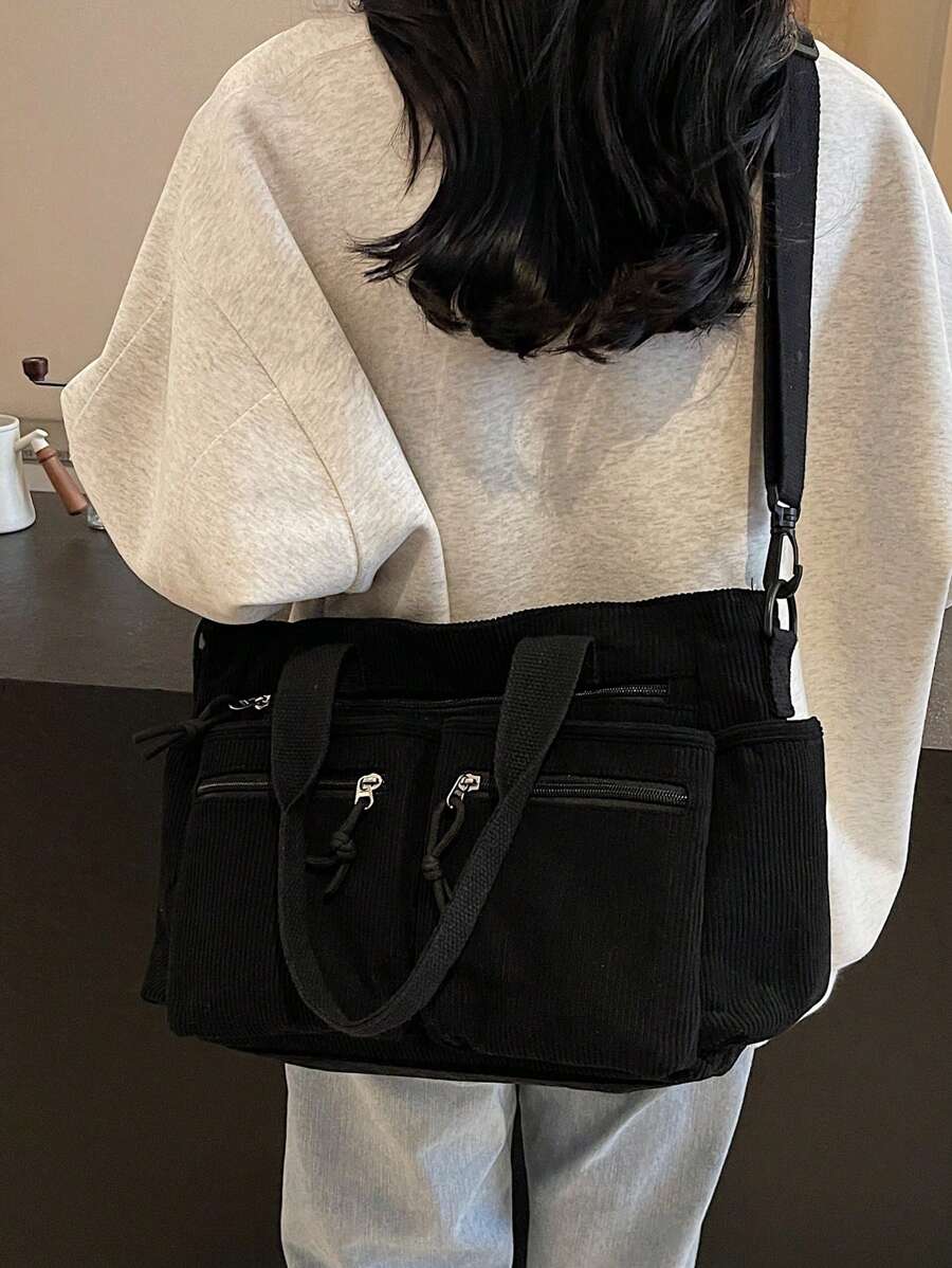 Carry your world in style with this chic corduroy shoulder tote. Crafted from soft, textured corduroy fabric, it's the perfect companion for weekend getaways, grocery runs, or just looking effortlessly put-together. The spacious interior fits everything from your laptop to your favorite book, while sturdy shoulder straps make it comfortable to carry all day long. Whether you're heading to the office or catching a flight, this versatile tote keeps your essentials organized and your vibe undeniably cool.