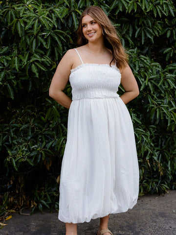 Step out in style with this playful midi dress featuring a shirred bodice that hugs your curves and a bubble hem that adds a fun, flirty bounce to every move. Perfect for effortless elegance, it blends comfort and chic for days when you want to feel fabulous without trying too hard.