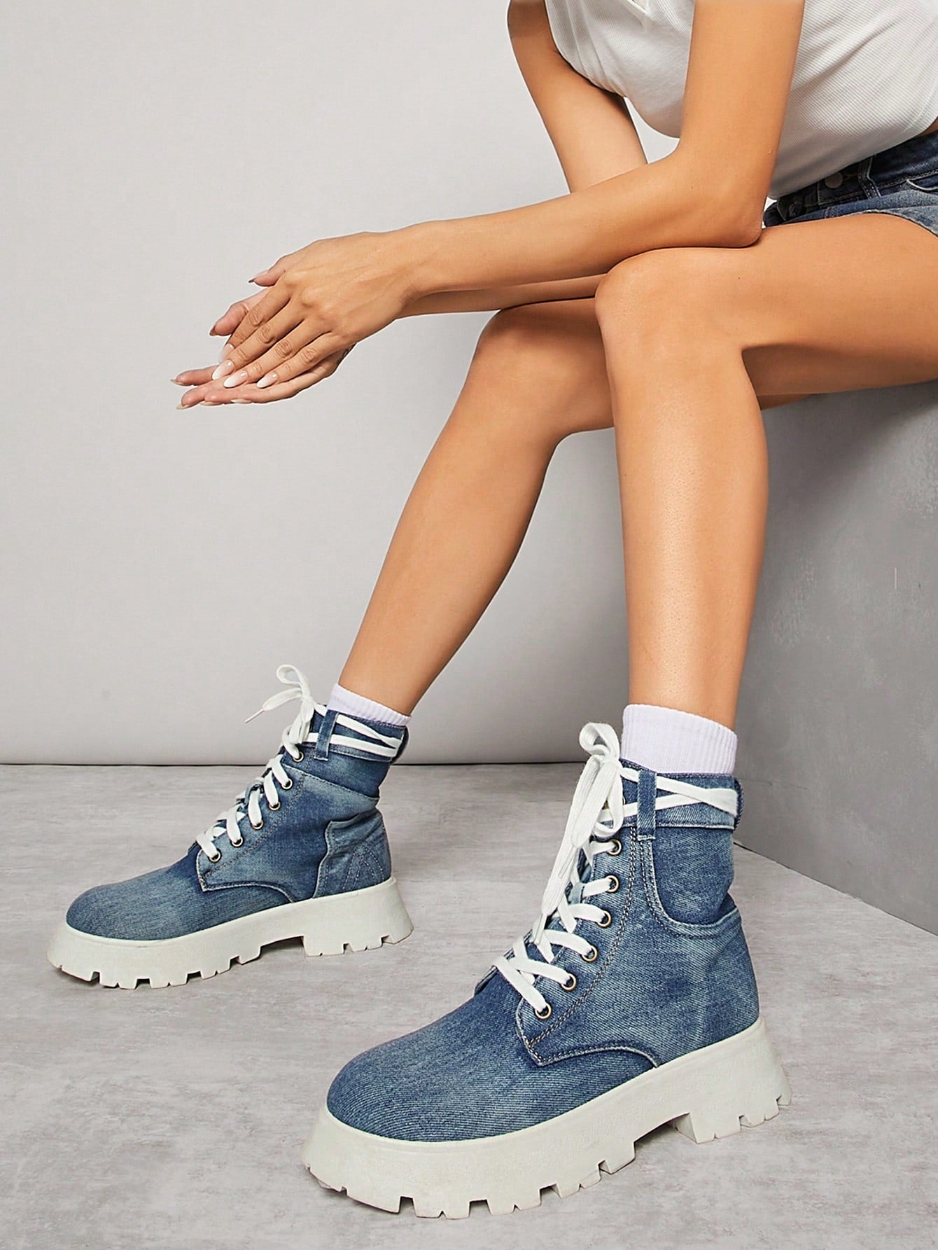 Elevate your style with our Stylish Denim Lace-Up Ankle Boots for Women. These boots combine comfort and fashion, perfect for any occasion. With their stylish lace-up design and durable denim material, you'll step out in confidence and style. Don't miss out on these must-have shoes!