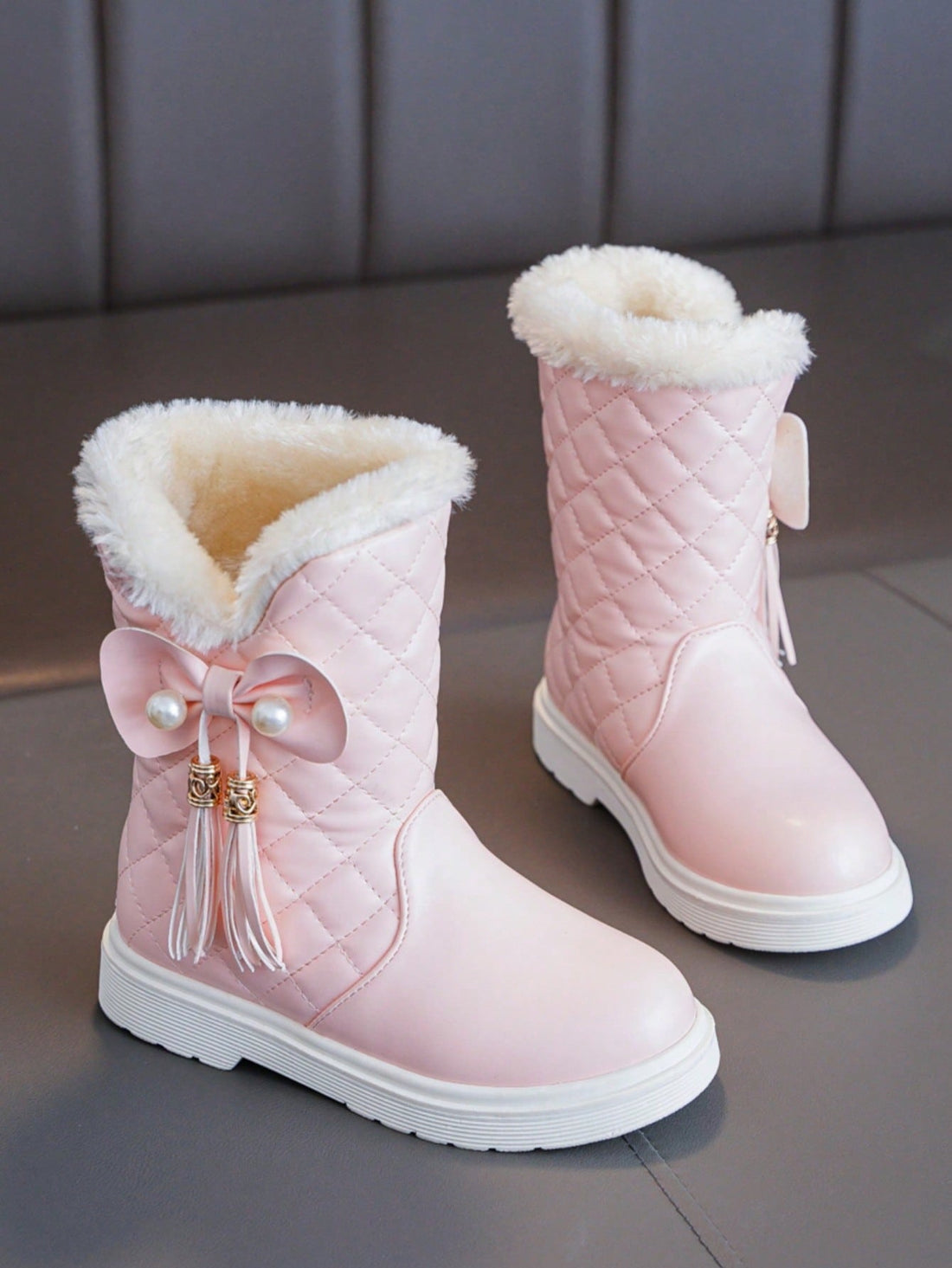 These Stylish Girls' Retro Fringe Tall Boots are perfect for keeping feet warm and cozy during the winter months. The retro fringe design adds a touch of style, while the tall height provides added warmth and protection. Don't sacrifice fashion for comfort with these must-have winter footwear essentials.