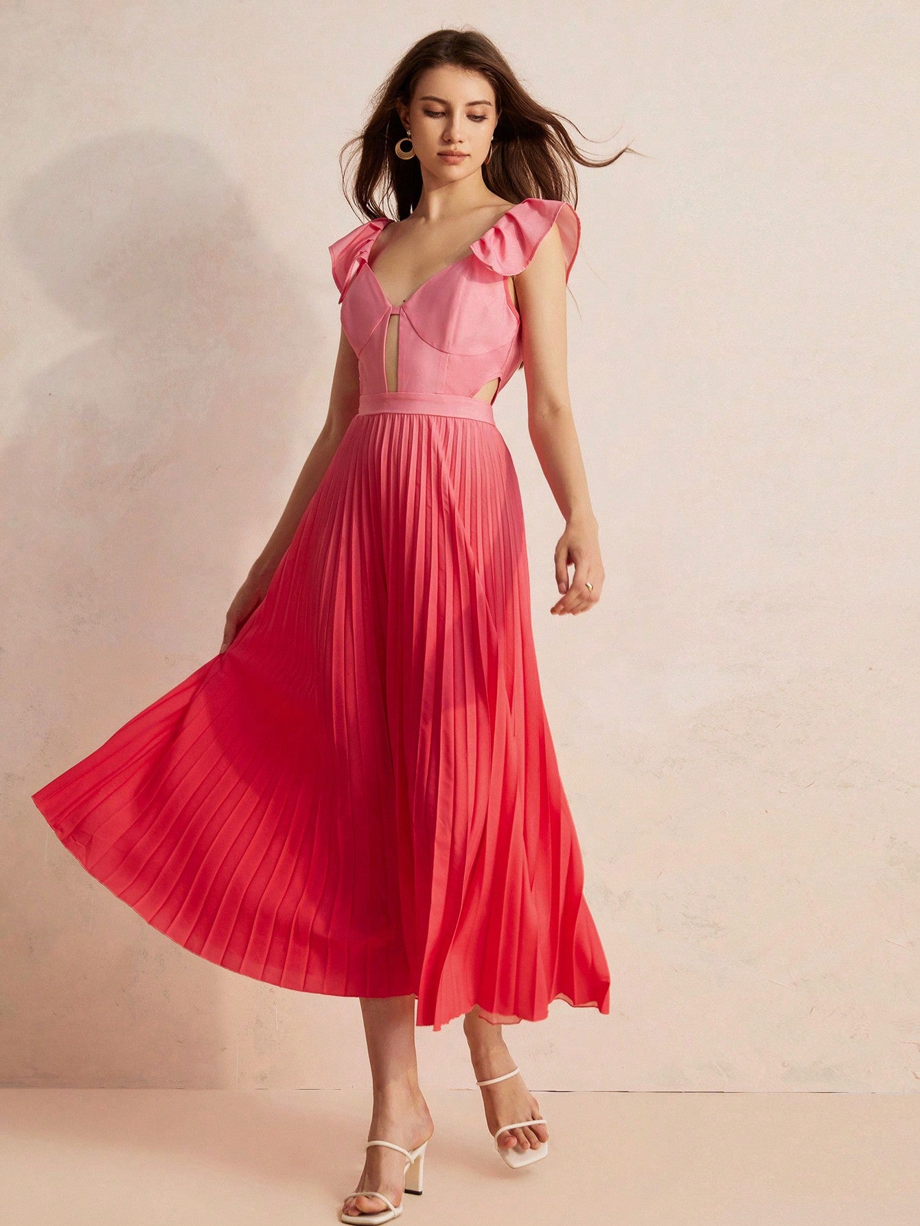 Turn heads in this playful gradient bodycon dress featuring a chic waist cutout that adds a flirty touch. The pleated hem brings movement and fun to your look, making it perfect for day-to-night adventures. Embrace your curves with style and confidence!