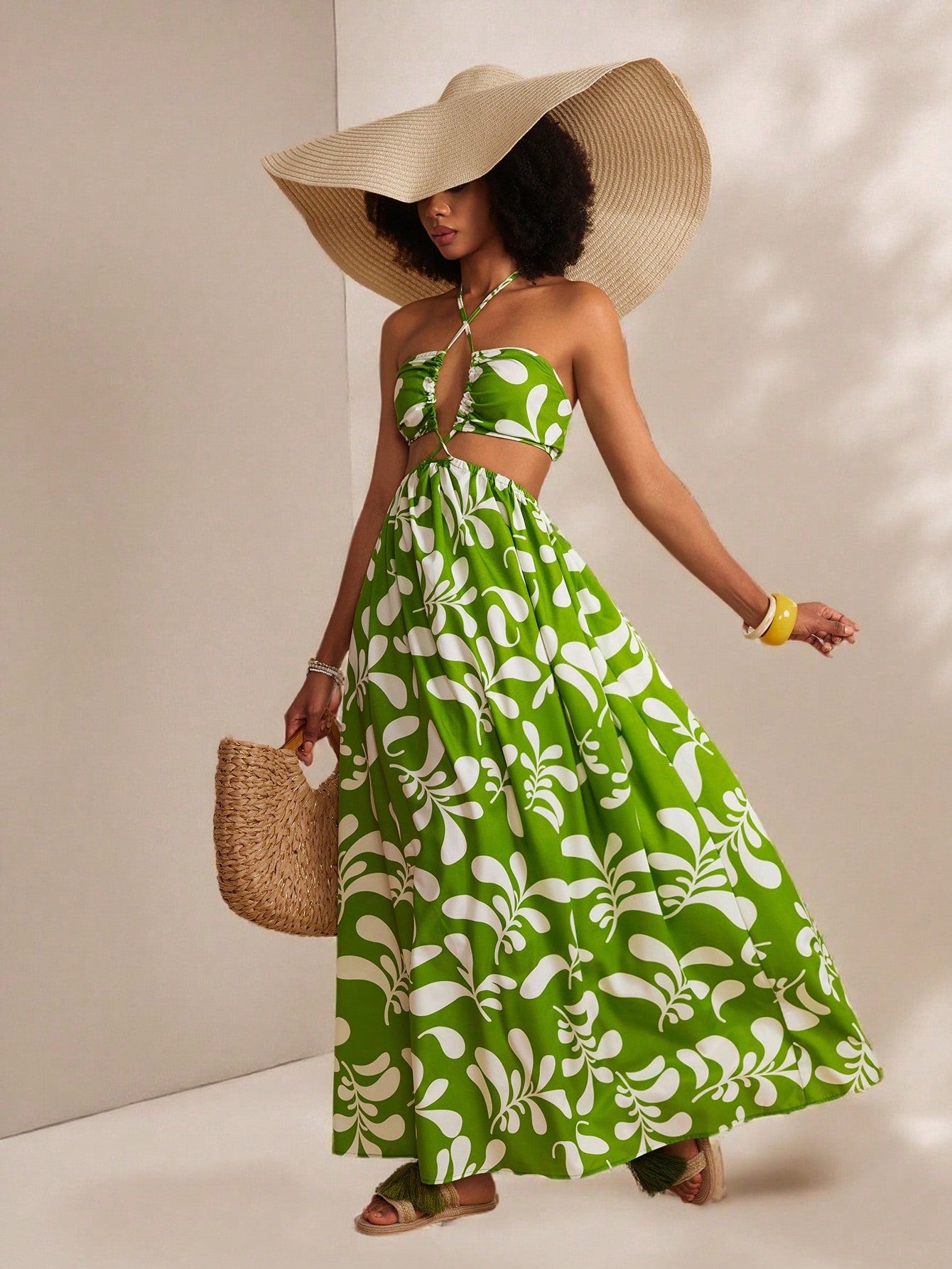 Get ready for effortless Hawaiian vibes with our stylish green plant print halter dress! Perfect for spring and summer vacations, this dress will have you feeling fresh and ready to soak up some sunshine. Embrace the island life in style with this quirky and playful dress.